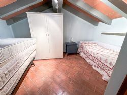 Appartamento Camelia : спальня с двумя кроватями