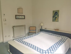 Villa Roccamare : спальня с двуспальной кроватью