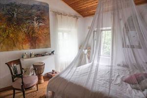 Villa Proxima : спальня с двуспальной кроватью